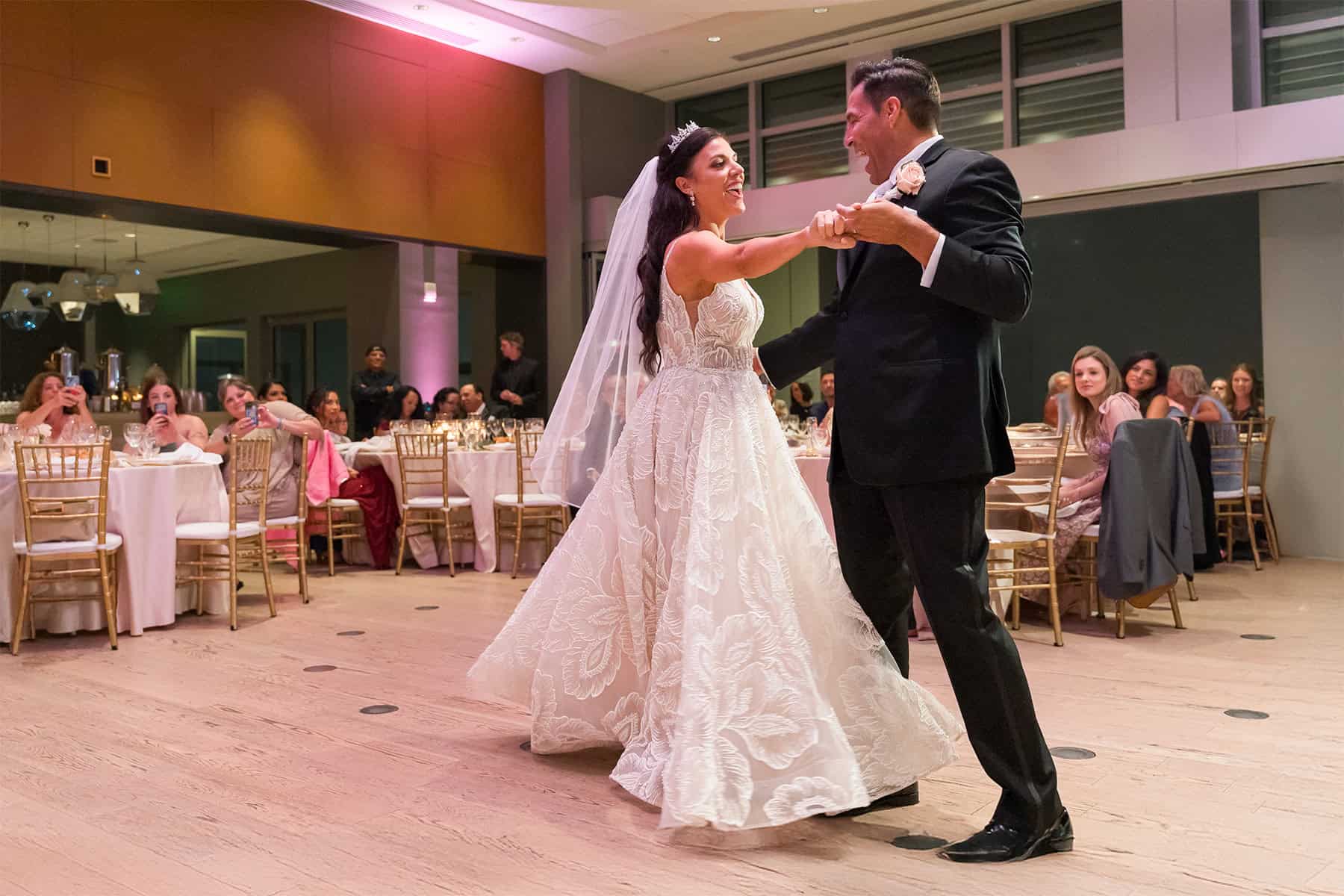 wedding-reception-first-dance-san-diego-skybox-downtown Bride and groom share their first dance at San Diego Skybox in Downtown
