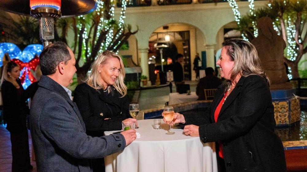 Special event photography at El Prado in Balboa Park featuring guests networking at an evening corporate event