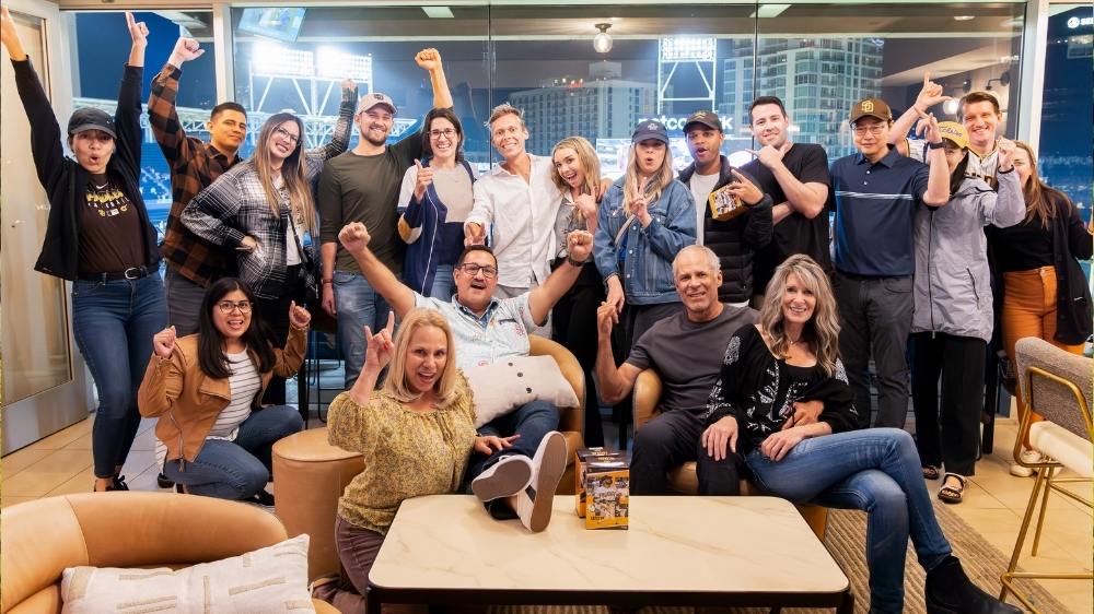 Special event photography of a San Diego company team enjoying a Petco Park suite gathering