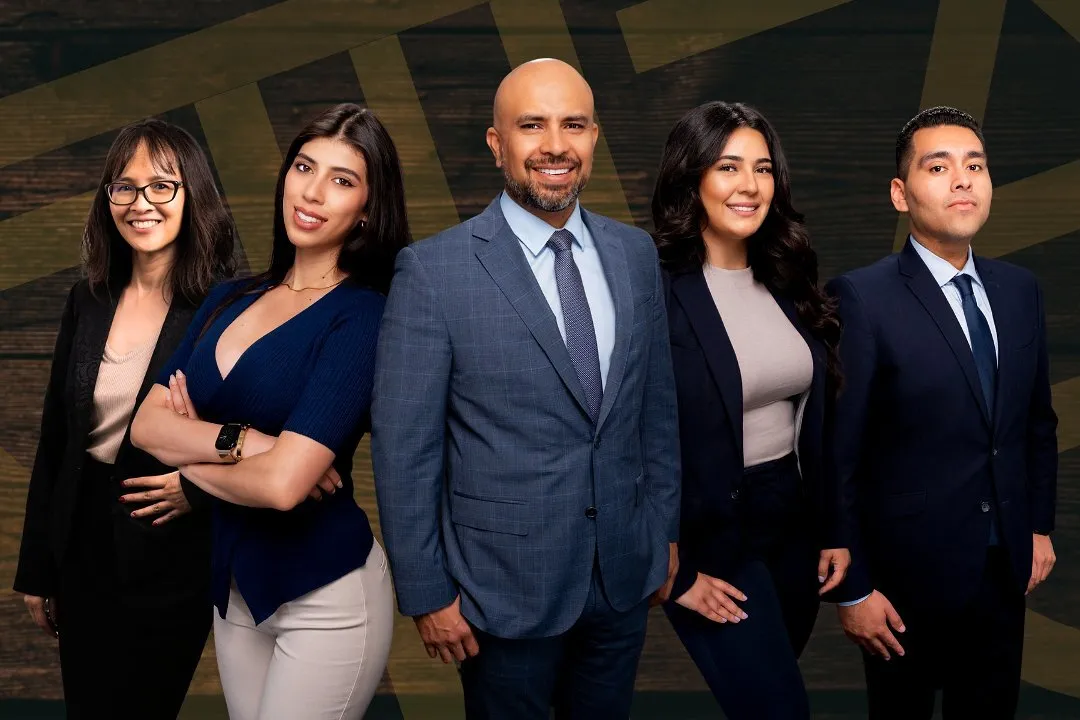 Professional corporate team of five business executives in formal attire posing for a business portrait photograph in San Diego.